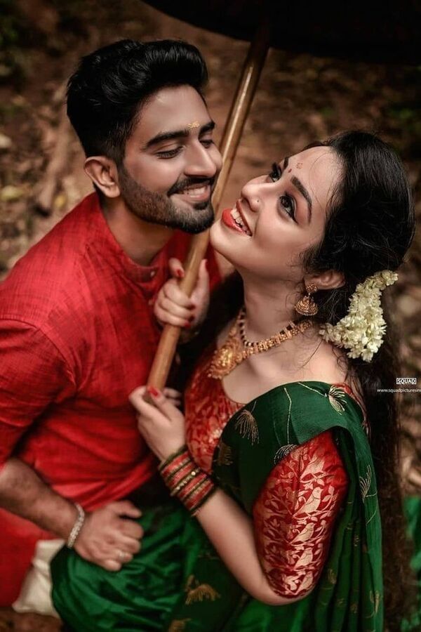 Indian couple in green and red traditional clothes