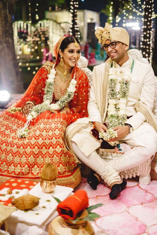 Indian wedding couple smiling at their ceremony