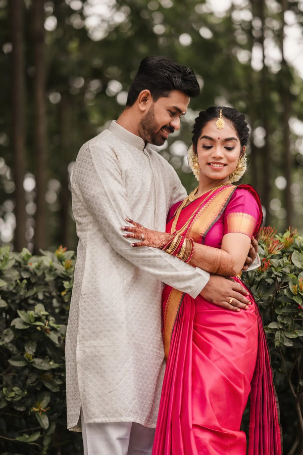 Tamil couple in a garden engagement portrait
